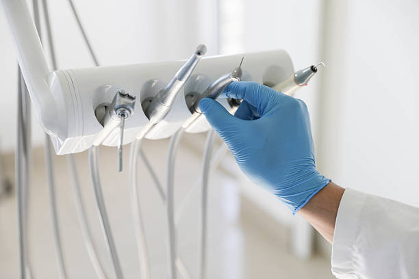 Professional Tooth Extraction technician working in Palm City, FL